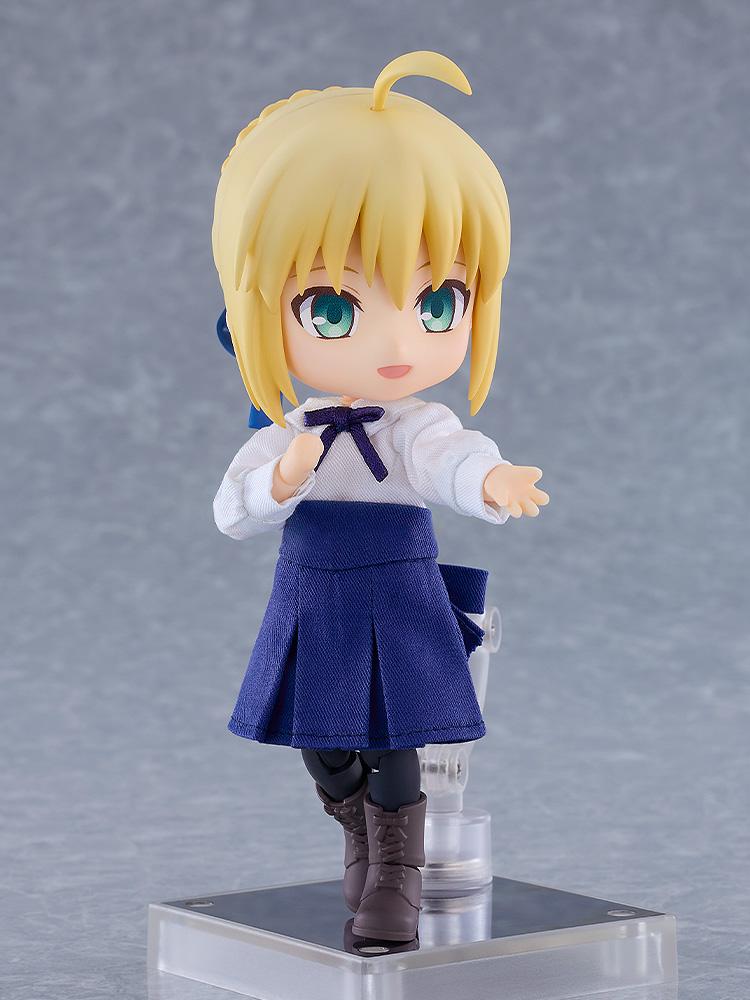 Front view of the Saber Nendoroid Doll figure in casual clothing reaching out with an open hand pose on a clear display stand.