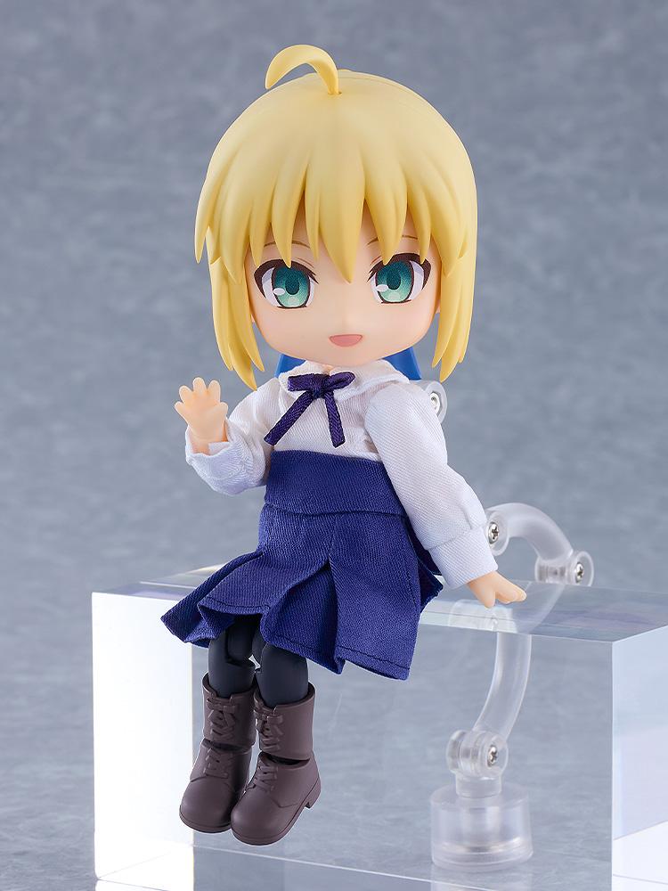Fate/Stay Night Saber Nendoroid Doll figure in a sitting pose waving her hand on a clear acrylic riser.