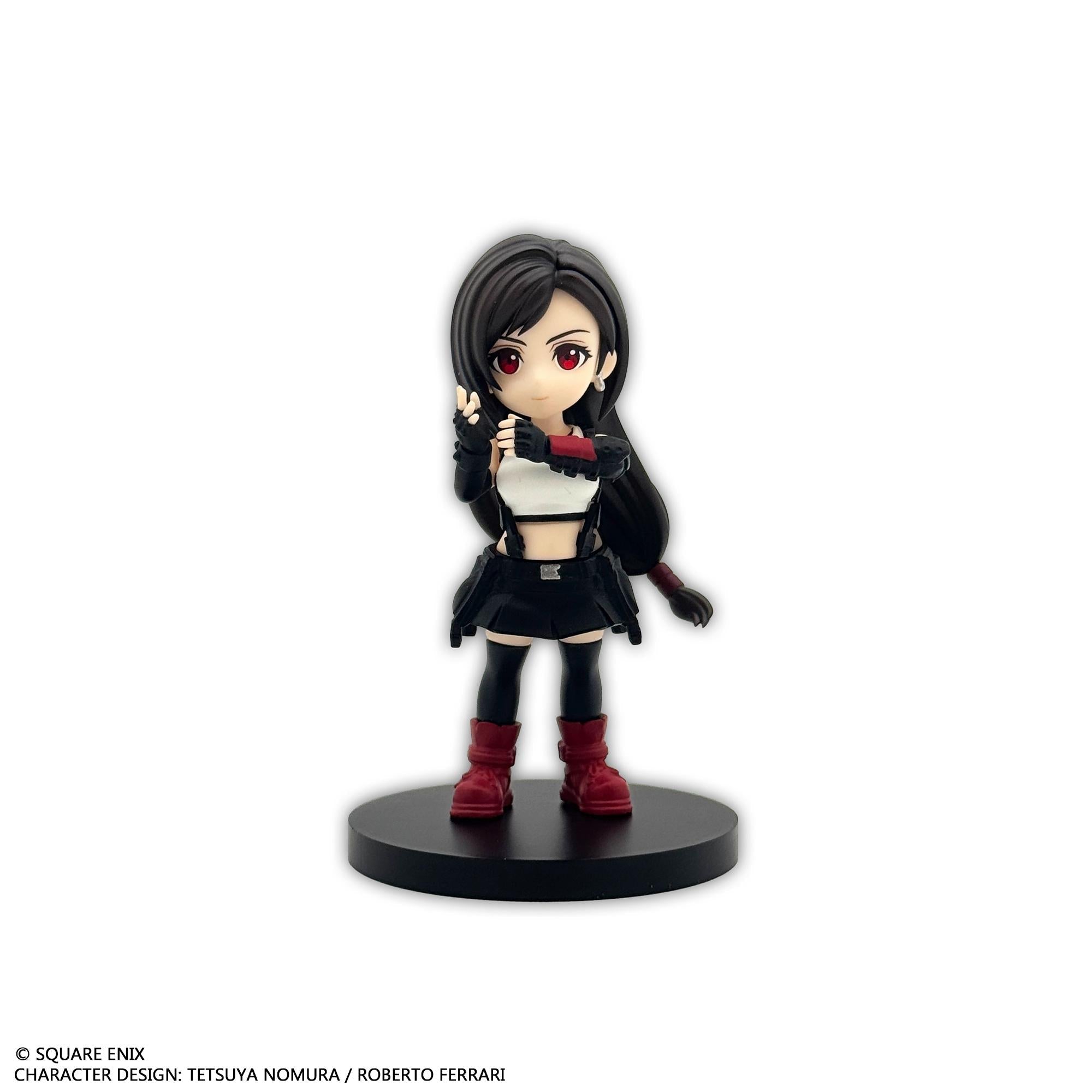 Front individual view of the Tifa Lockhart mini figure with long black hair, red eyes, a white crop top, black skirt, and red boots.