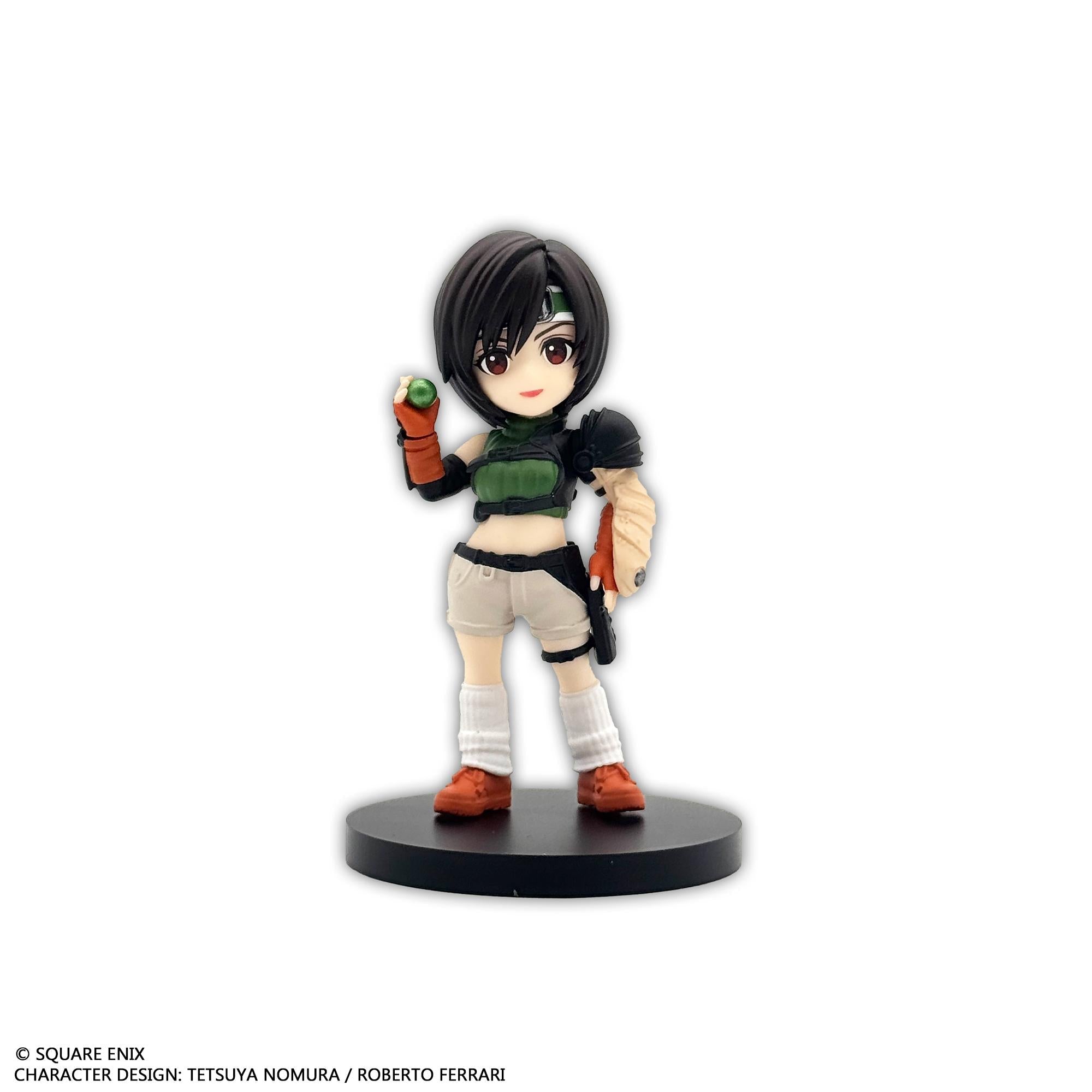 Front individual view of the Yuffie Kisaragi mini figure wearing her classic green armor plate, shorts, white socks, and holding a small green orb.