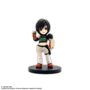 Front individual view of the Yuffie Kisaragi mini figure wearing her classic green armor plate, shorts, white socks, and holding a small green orb.
