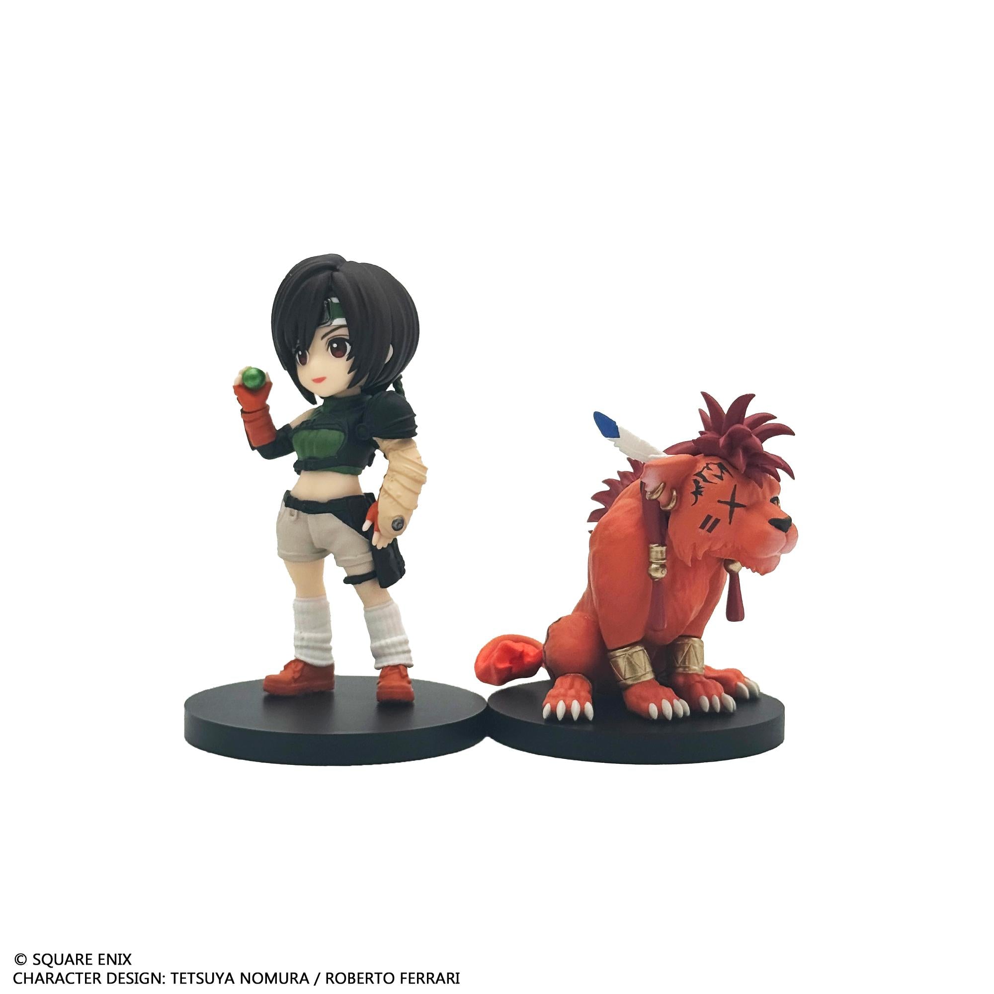 Side-by-side display of the Yuffie Kisaragi mini figure holding a green materia next to the sitting Red XIII mini figure.