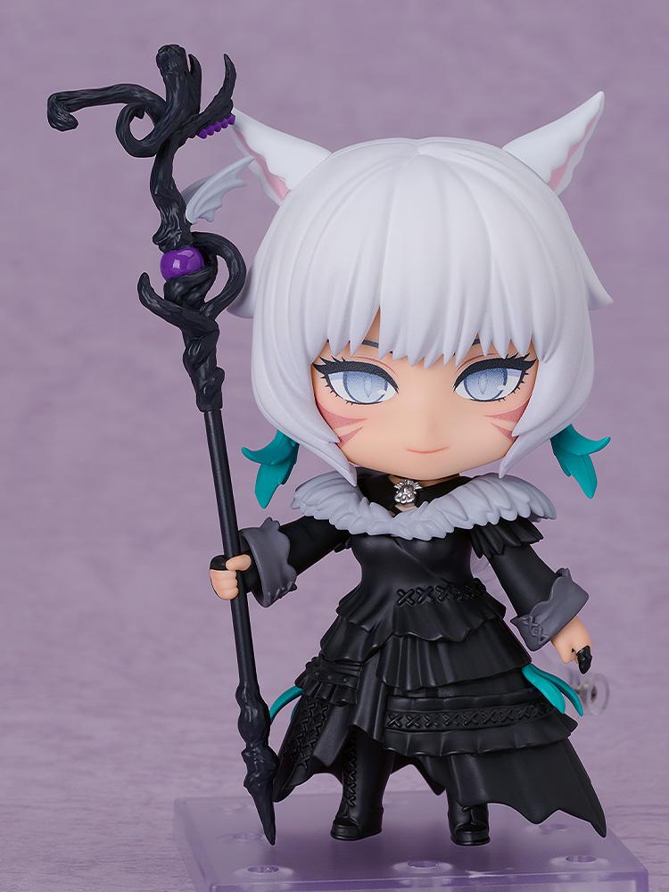 Front display shot of the Y'shtola Nendoroid figure from Final Fantasy XIV holding the Nightseeker staff on a clear base against a purple studio backdrop.