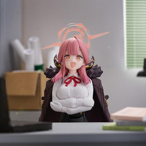 Aru Rikuhachima figma sitting at a desk with crossed arms and a nervous sweating facial expression.