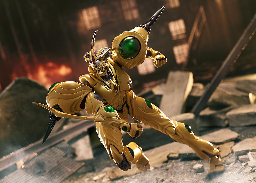 The figma Guyver Gigantic action figure in a dynamic mid-air combat pose against a destroyed city backdrop.