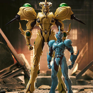 Scale comparison showing the massive figma Guyver Gigantic action figure standing next to the standard Guyver I figure in a ruined city.