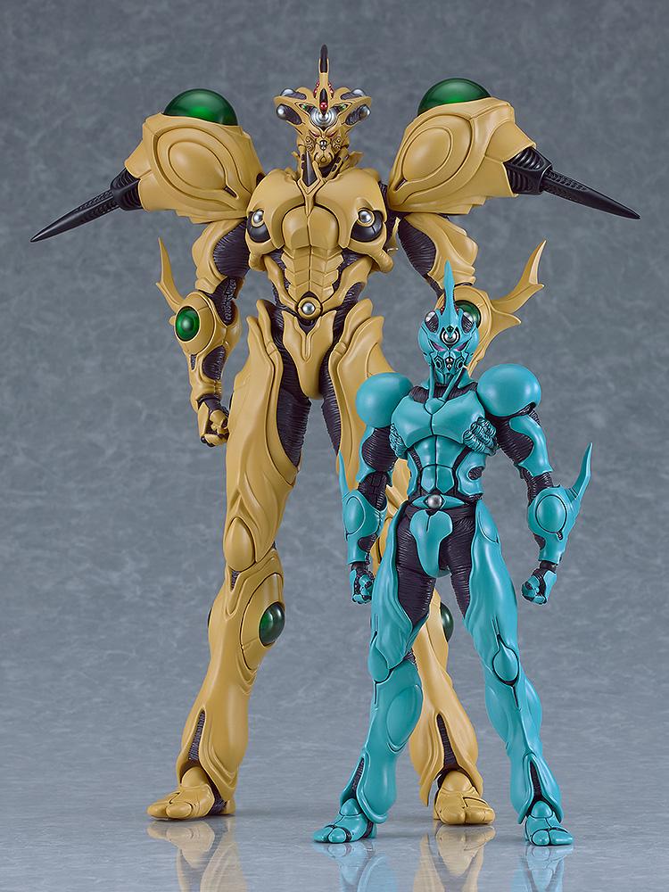 Size comparison of the figma Guyver Gigantic standing next to the Guyver I figma on a solid grey studio background.