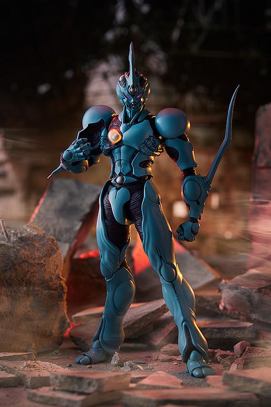 Cinematic diorama display of Guyver I figma in a nighttime urban battleground setting.