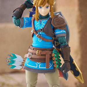 Close-up of the Link figma's smiling face plate with his hand on the hilt of the Master Sword.