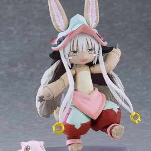 Dynamic side-stepping pose of the figma Nanachi action figure showing full articulation, big ears, and long white tassels.