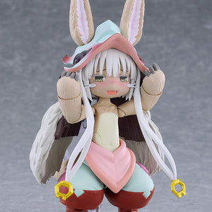 Close-up of the figma Nanachi figure displaying her blushing face plate expression while holding both paws up near her face.