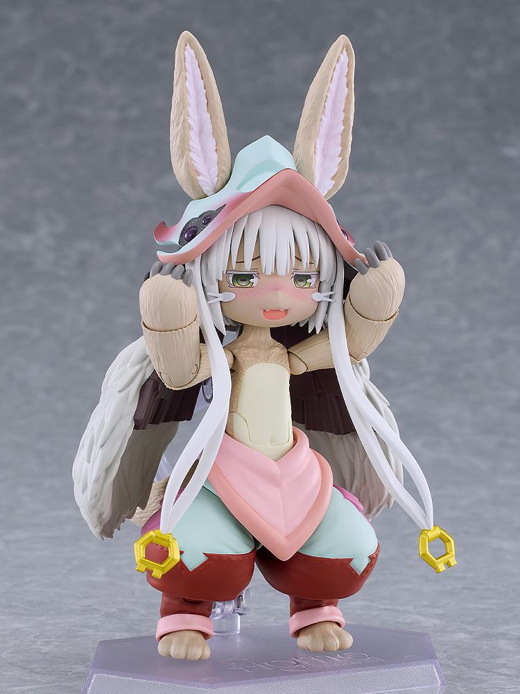 Close-up of the figma Nanachi figure displaying her blushing face plate expression while holding both paws up near her face.