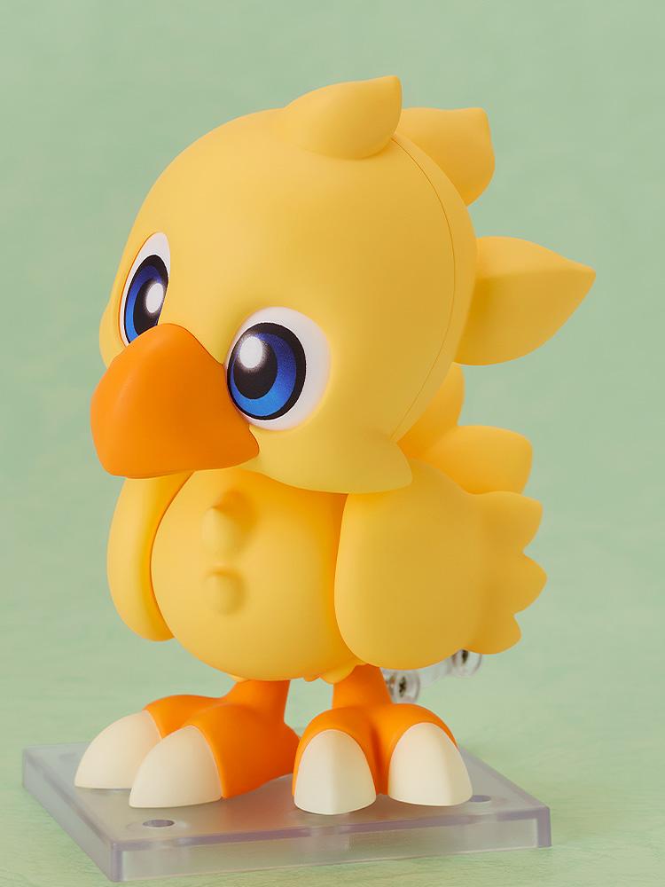 A side profile of the Chocobo Nendoroid figure showing the feathered tail and rounded body design.