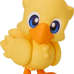 A front-facing studio shot of the yellow Chocobo Nendoroid figure from Final Fantasy with large blue eyes and an orange beak.