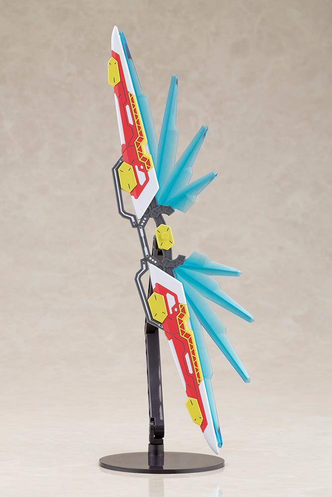 Close-up view of the Fossil Bauer double saber weapon from the Kotobukiya model kit, shown vertically on a stand in its deployed mode with clear blue energy wings.