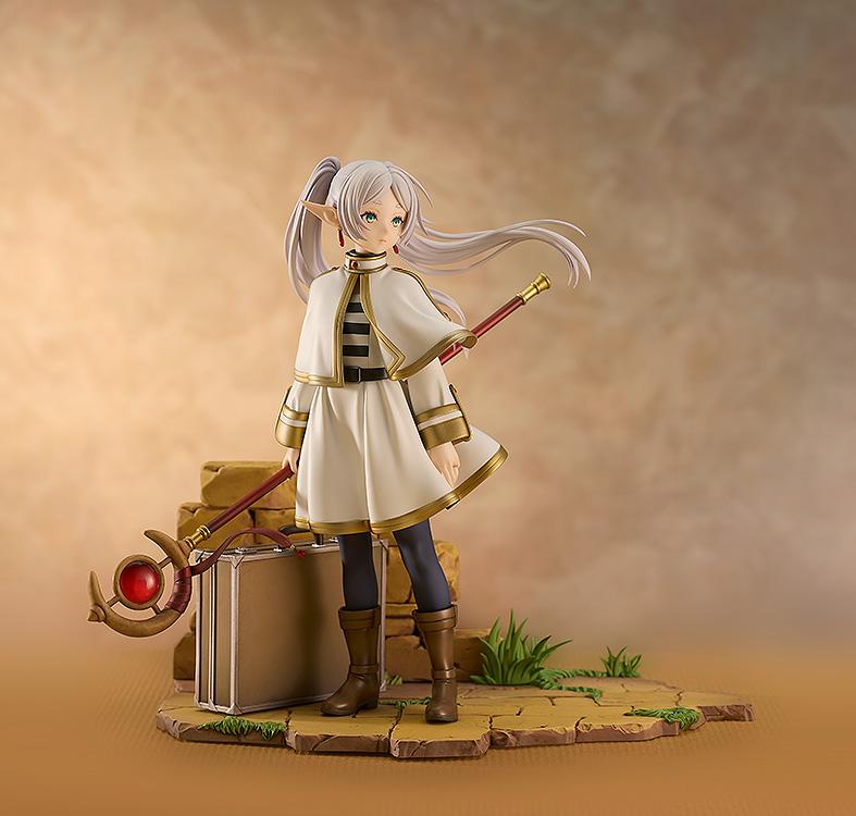 Wide shot of the Frieren Magic of the Eventide Glow figure against a warm, atmospheric background.