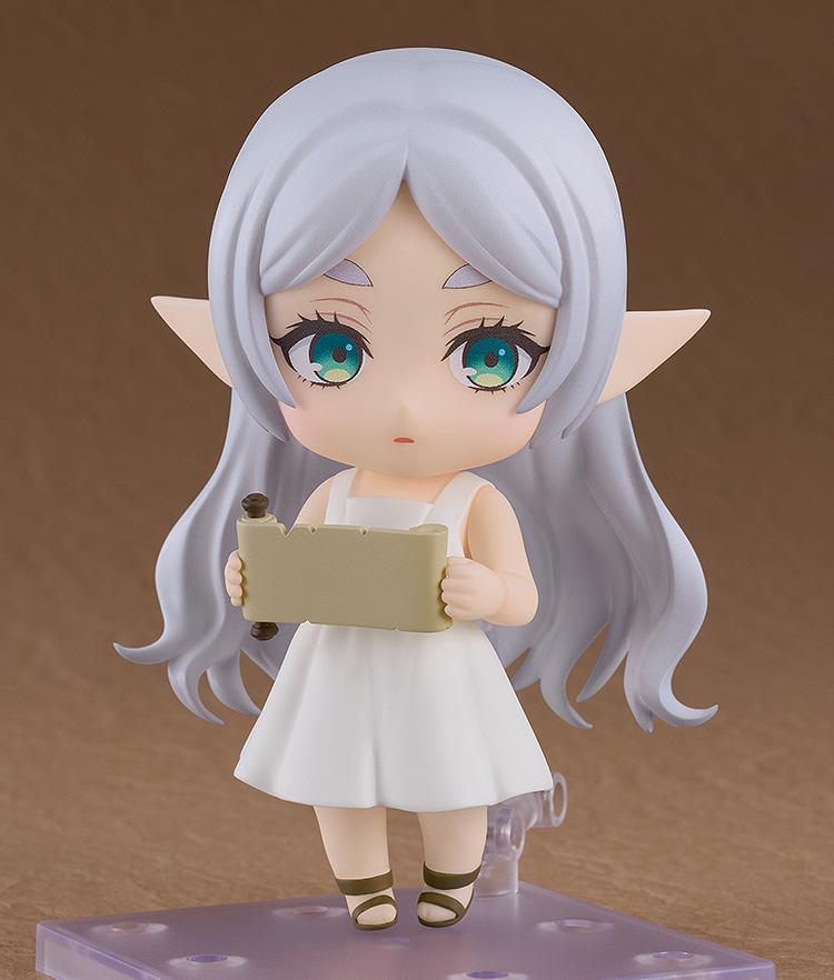 Apprentice Era Frieren Nendoroid holding a scroll accessory with both hands in a neutral expression.