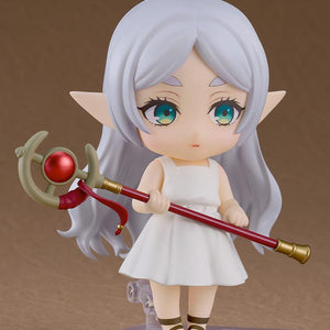 A side-facing action pose of the Frieren Apprentice Era Nendoroid holding her staff horizontally across her body.
