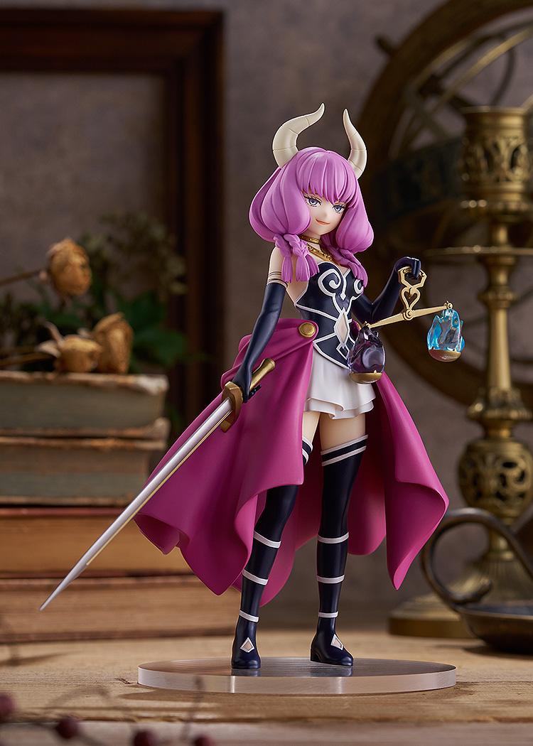 Full-body front view of Good Smile Company's Aura POP UP PARADE figure displayed on a wooden surface with vintage books in the background.