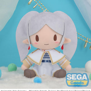Front view of the 9-inch fuwa petit Frieren medium plush by Sega, featuring her iconic white and gold attire and pigtails, sitting on a fluffy white surface.