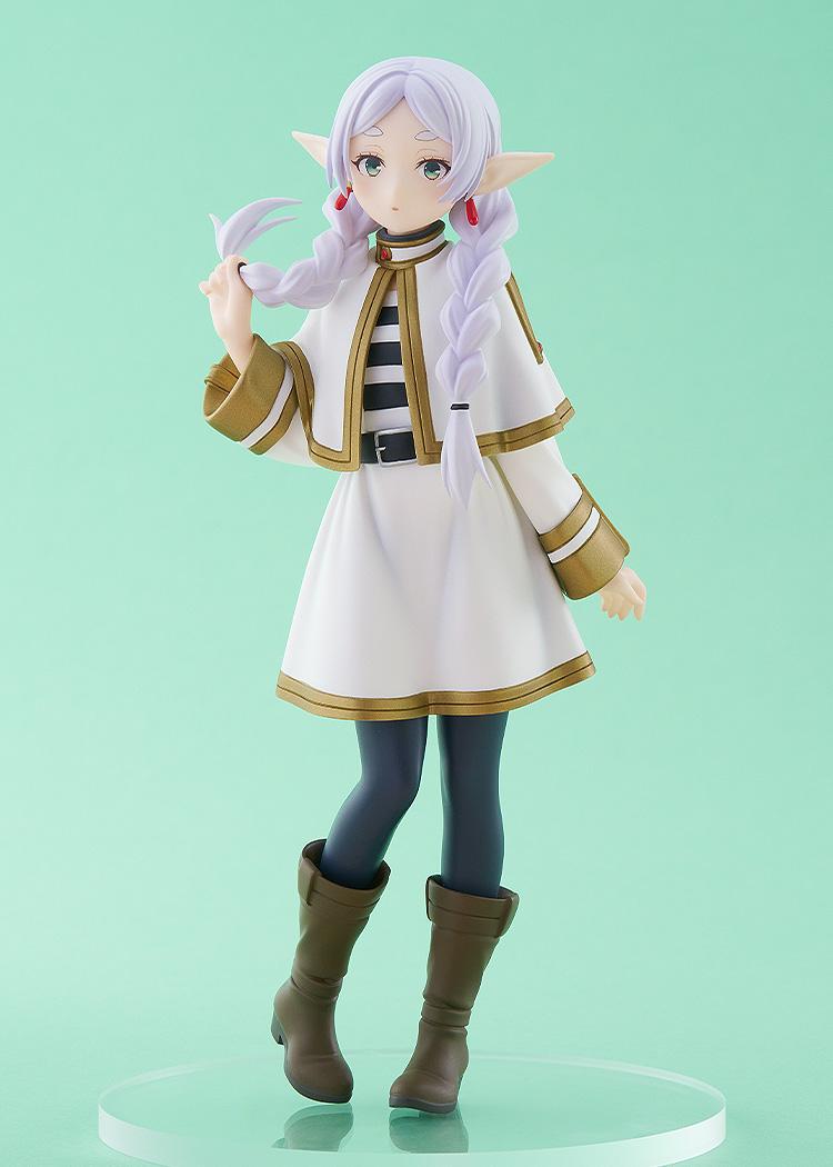 Full-body studio shot of the Frieren elf mage anime figure standing on a clear round base against a solid light green background.