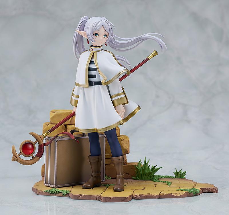 Studio product shot of Frieren 1/7 scale statue on a clean white background showing all accessories.