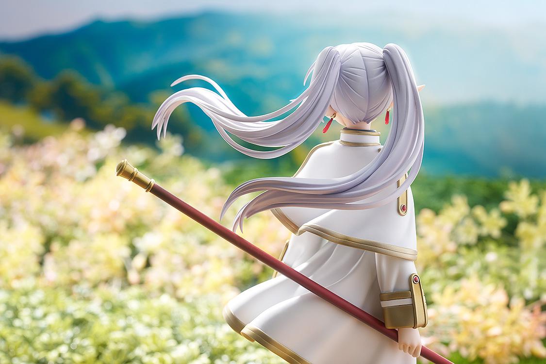 Cinematic rear view of the Frieren figure looking out over a mountain landscape.