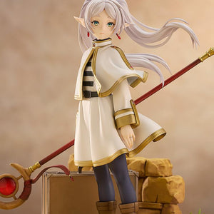 Detailed mid-shot of Frieren the mage in her signature white and gold outfit with her staff.