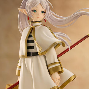 Close-up portrait of Frieren figure showing her solemn expression and flowing white hair.