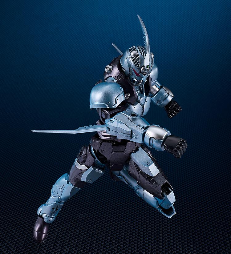 Dynamic action pose of the Gale Hound Guyver 01 model kit lunging forward with forearm blades extended.