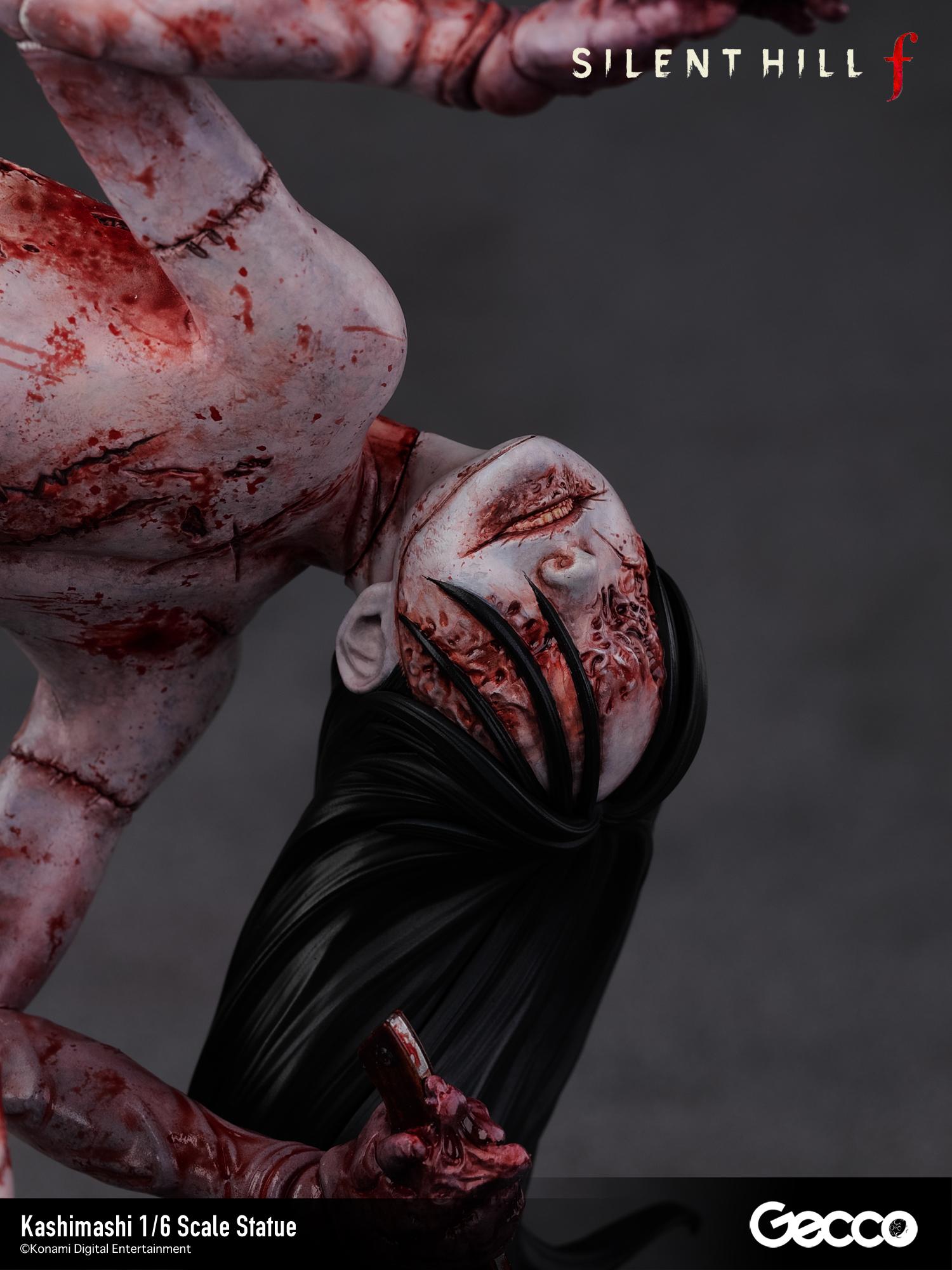Macro view of the Kashimashi head sculpt, highlighting the interplay of the black hair and the mutilated, smiling facial features.