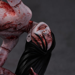 Macro view of the Kashimashi head sculpt, highlighting the interplay of the black hair and the mutilated, smiling facial features.