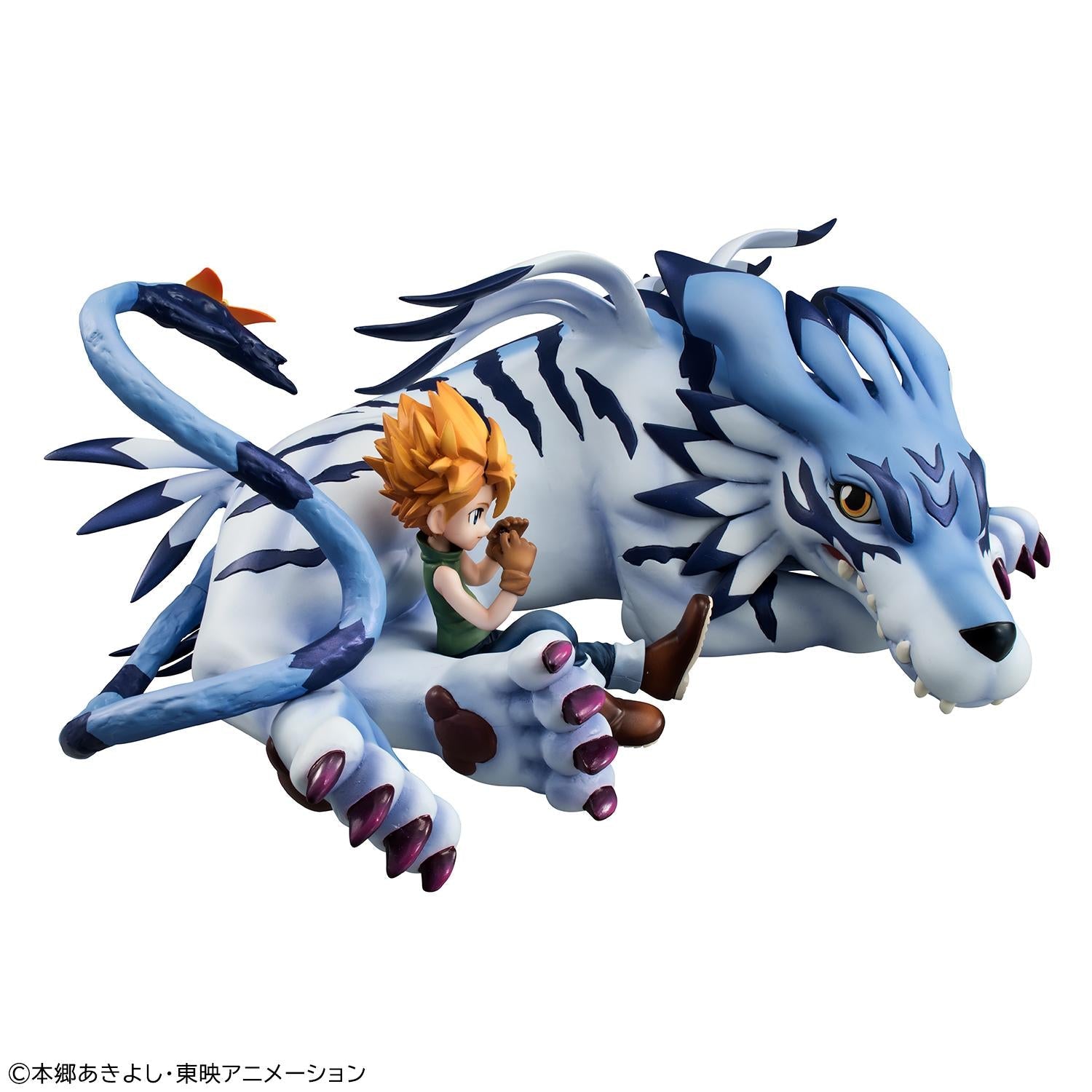 High-angle view of G.E.M. Garurumon showing purple claws, striped blue coat, and Yamato sitting by his paw.