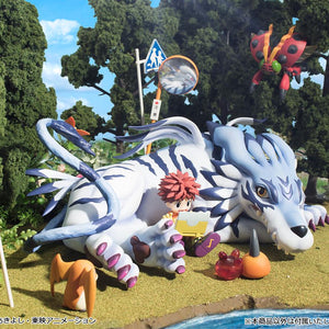 Outdoor nature diorama display showing G.E.M. Garurumon resting in a grassy landscape alongside Digimon Adventure companion figures.