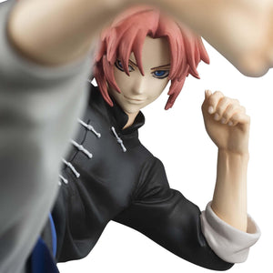 Dramatic close-up of Kamui's smiling face sculpt and blue eyes framed by his raised kicking leg.