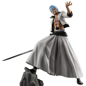 Low-angle battle stance of Bleach Grimmjow Jaegerjaquez G.E.M. Series figure perched on rocky terrain base.