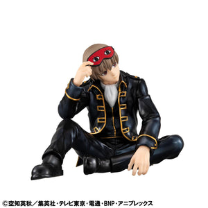 Front-facing view of the palm-sized Sogo Okita figure lounging with a thoughtful expression and sleep mask.