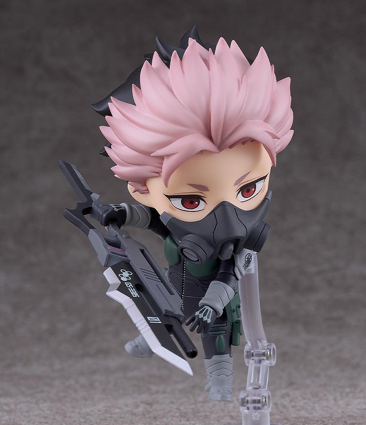 Action pose of Gen Narumi Nendoroid wearing his black Defense Force mask and aiming his weapon.