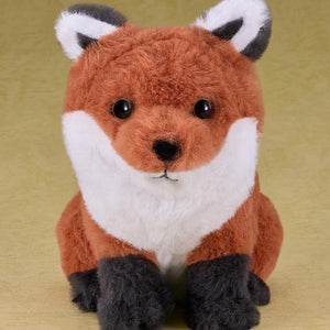 Full-body studio shot of the sitting fox plushie inspired by Jin Sakai's companion in the Ghost of Tsushima video game.