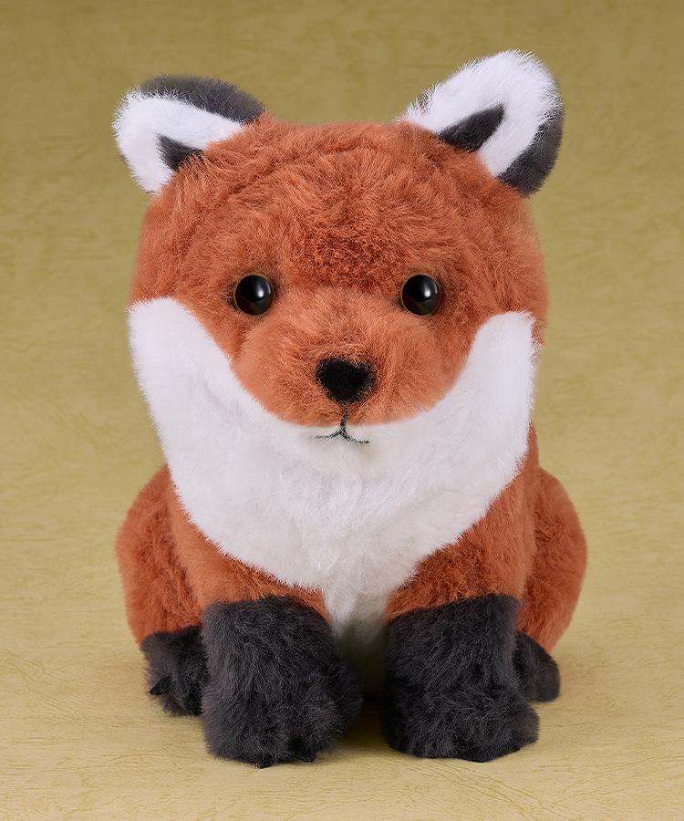 Full-body studio shot of the sitting fox plushie inspired by Jin Sakai's companion in the Ghost of Tsushima video game.