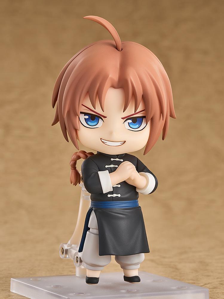 Studio display shot of the Kamui Nendoroid figure from Gintama standing with arms crossed and a smirking combat expression.