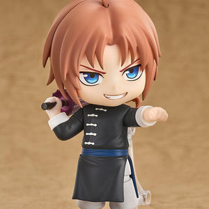 Dynamic combat pose of the Gintama Kamui Nendoroid figure displaying a smirking combat face plate and holding a folded umbrella.