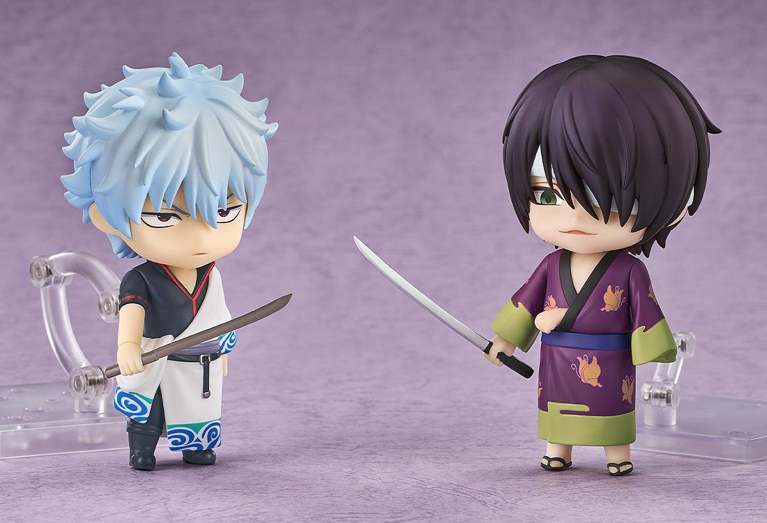 Battle pose display featuring the Shinsuke Takasugi Nendoroid facing off against the Gintoki Sakata Nendoroid figure with drawn swords.