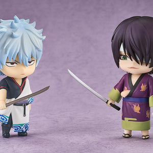 Battle pose display featuring the Shinsuke Takasugi Nendoroid facing off against the Gintoki Sakata Nendoroid figure with drawn swords.