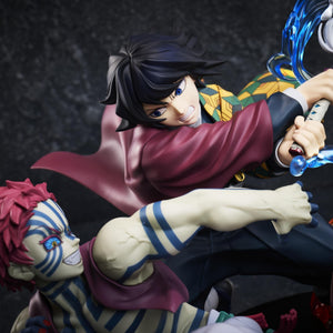 Close-up shot of Giyu Tomioka wielding his Water Breathing Nichirin sword alongside Akaza in the Aniplex battle figure