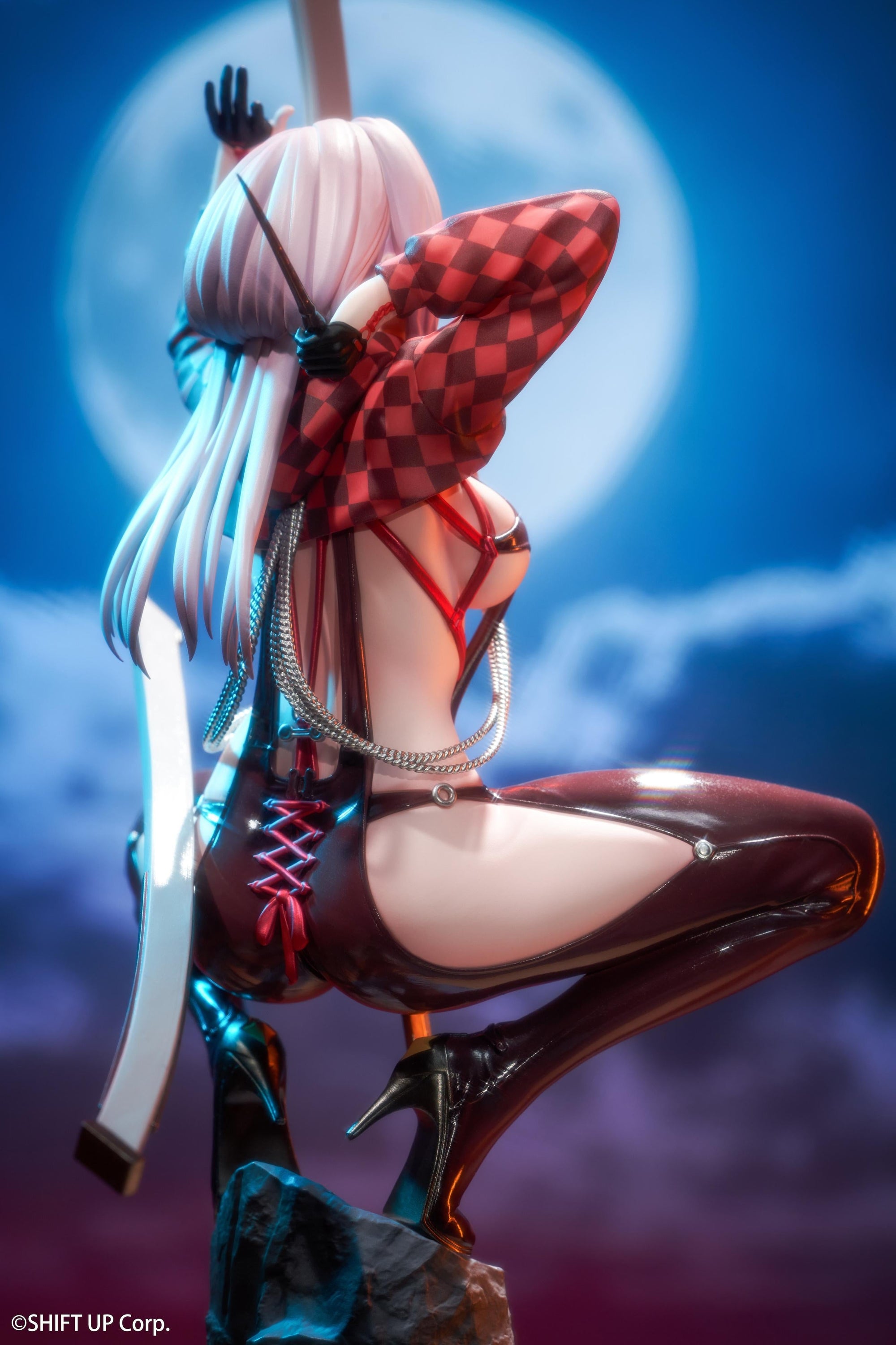 Close-up back view of the Goddess of Victory: Nikke Scarlet figure, highlighting the glossy red texture of her suit under nighttime lighting.