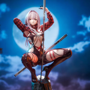 Low angle front view of the Hobby Sakura Scarlet figure against a moonlit sky, emphasizing the highly detailed finish of her racing outfit.