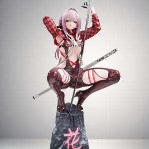 Full front view of the Goddess of Victory: Nikke Scarlet (Racer's High) 1/10 scale figure crouching on a rock base with a sword against a light studio background.