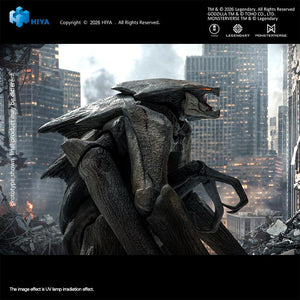 Close-up side profile of the MUTO action figure showing the articulated roaring lower jaw and textured gray skin against a ruined cityscape.