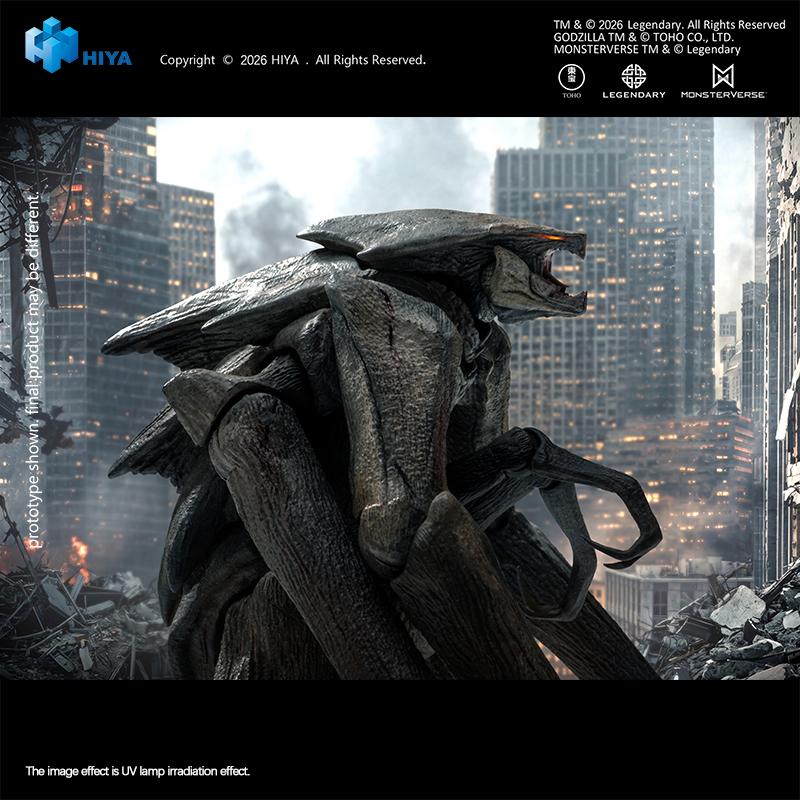 Close-up side profile of the MUTO action figure showing the articulated roaring lower jaw and textured gray skin against a ruined cityscape.